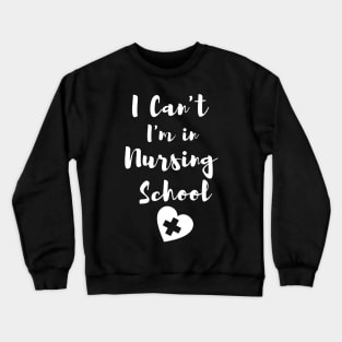 I Can't I'm in Nursing School in White text with heart design Crewneck Sweatshirt